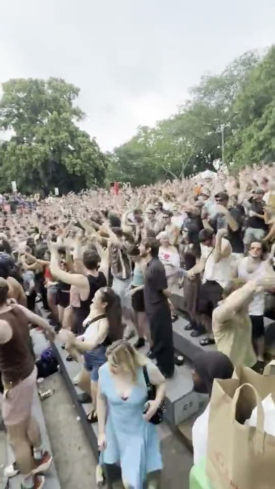 Dancing in front of the Public Service banner