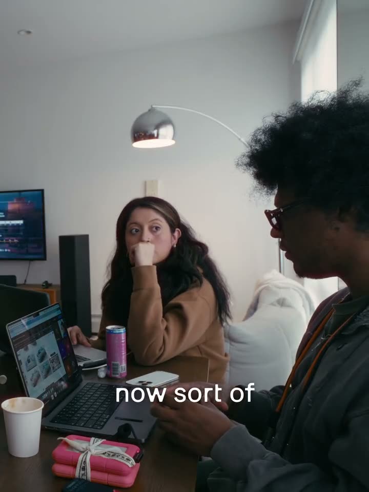 Working at a table with laptops and hard drives