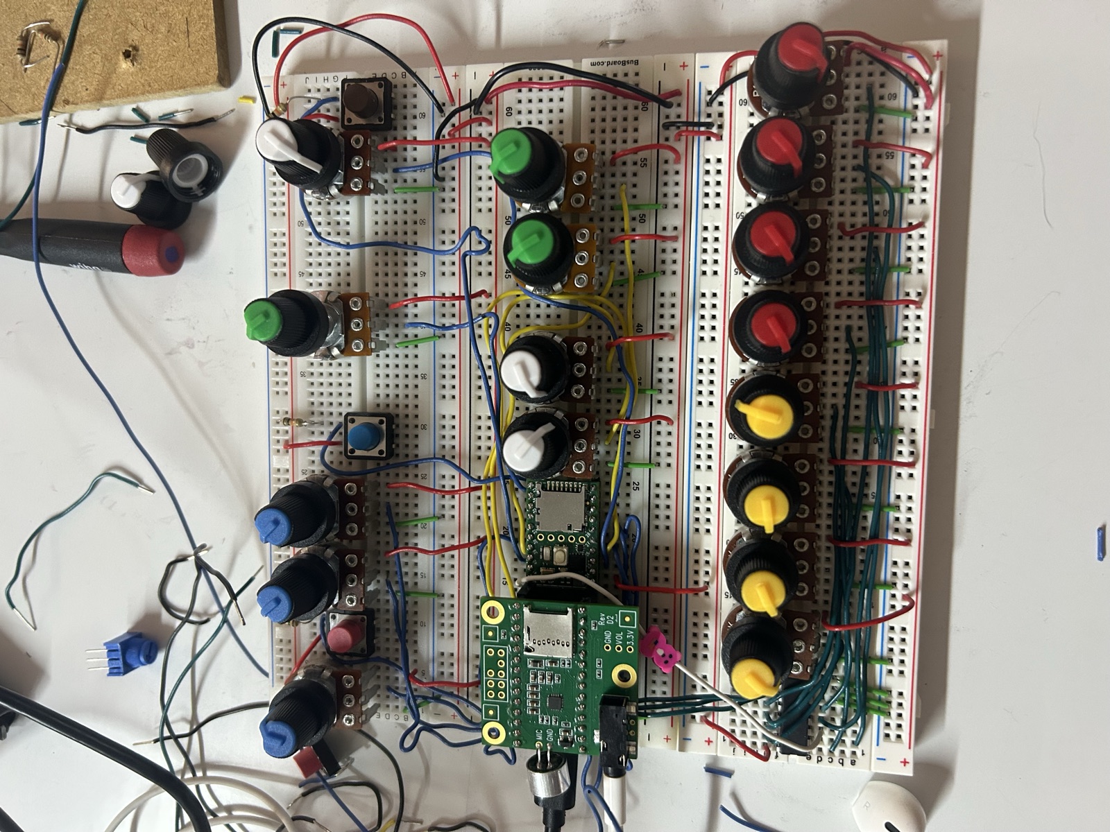 Breadboard prototype for Serenity Synth, dense with knobs and jumpers